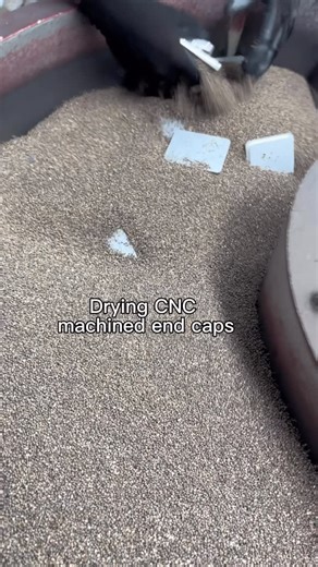 End Cap perfection 👌 Removing burrs and sharp edges from these @nelsonscnc metal end caps for fencing. All our end caps are made in house on CNC machines. They have an interference fit for a quick yet snug install. Our caps go through a polishing machine and then are finished in the dryer. Fun fact: The dryer media smells like popcorn 🌽 Find your fit on our website. #nelsonscnc #pressfitendcaps #aluminiumendcaps #endcaps #battenfencing #postcaps | Nelsons CNC