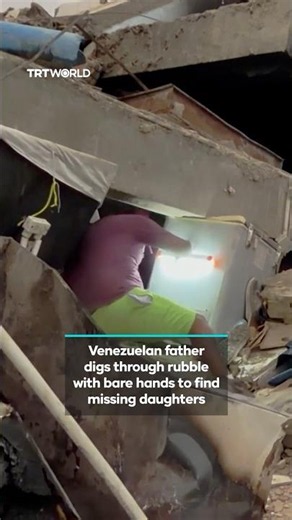 Venezuelan father digs through rubble with bare hands to find missing daughters