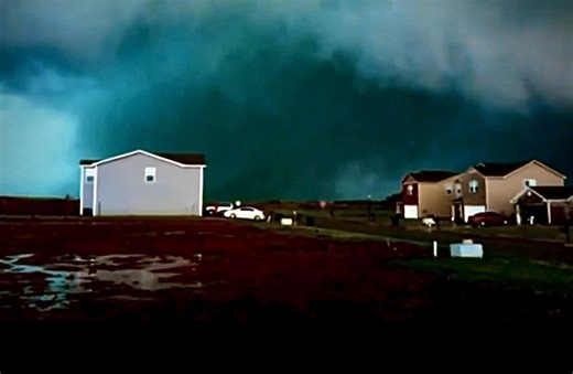 April 27, 2011 – Harvest, Alabama The sky had turned a deep mix of blue and green as the Hackleburg EF5 crept closer. You can almost feel the air go still in this moment — no sirens, no roar yet, just quiet tension before everything changed. | Carrier WX Initiative