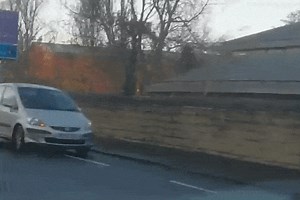 Driver stunned as two people have a drink on each side of the Edinburgh border.