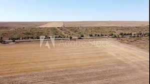 Desolate gloomy agricultural landscape in the countryside, shooting from a height.