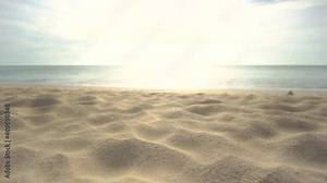 Beach Sand Texture. Scene of Beautiful beach sand texture in summer sun. Blur Beach sea relaxing and sky sunlight in sunset time. Camera on slide dolly.