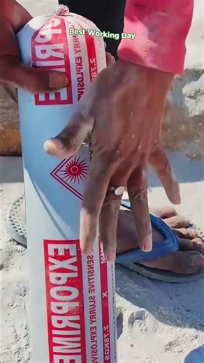 Process of placing an explosive charge in a white polymer package into a hole at a construction site