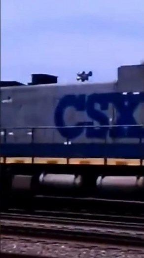 CSX train towing old switch engine