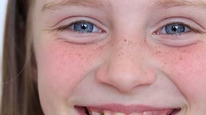 clip-27670066-close-young-smile-girl-eyes-she-stares