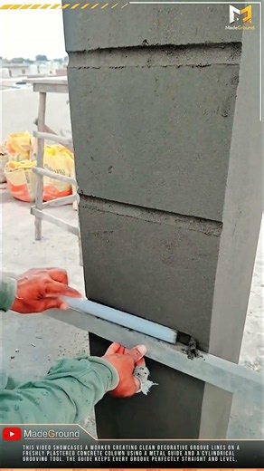 Worker Creates Decorative Groove Lines on Concrete Column with Precision Guide