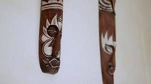antique wooden sculpture hanging on the wall