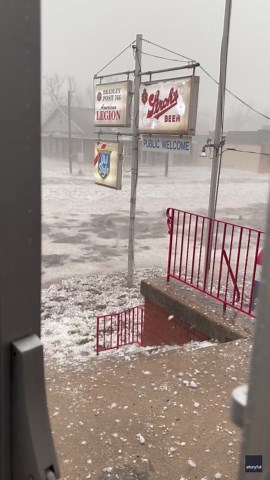 'Extreme hail' pummels flooded street as severe storms hit Illinois