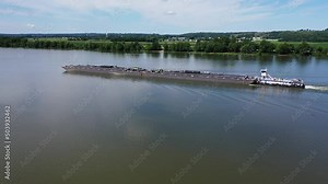 River barge traveling down the Ohio River by Cincinnati, Ohio and Northern Kentucky