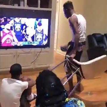 Angry man destroys his television after losing bet