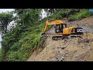 JCB Excavator and Wheel Loader Excavating Mountain Highway