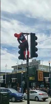 Spider-Man twerking on a streetlight