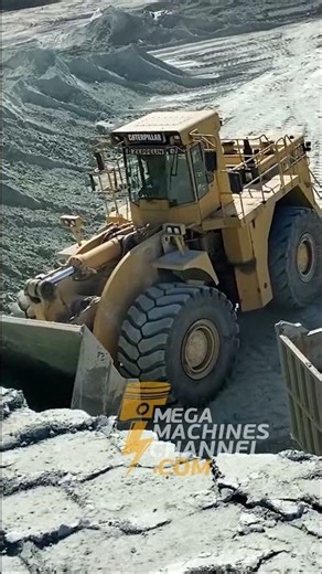 Gigantic Wheel Loader Loading Trucks