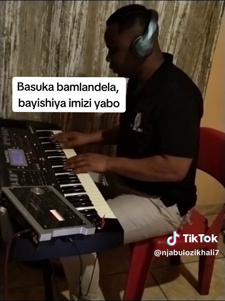Playing Keyboard: Basuku Bamalandela Musical Performance