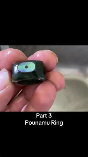Part 3 Pounamu Ring Heres some pāua shells being added as an accent to the pounamu/jade ring Ive been carving, If yous have been enjoying this content make sure to hit the likes, repost and shares and don’t forget to write in the comments your thoughts on this piece, is there anything else yous would like to see me try to carve? If so make sure to follow and let me know. 🫡🤟 #handcrafted #jadering #jewelrybusiness #pounamu #rootsofwisdom
