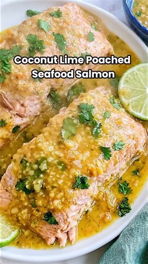 Coconut Lime Poached Seafood Salmon 🐟🍋This seafood salmon gently poaches in coconut cream