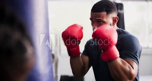 Man, boxer and punching bag for fitness, workout and coach with gym training in MMA, fight and support. Strong people with fist, power or boxing challenge and personal trainer helping with exercise