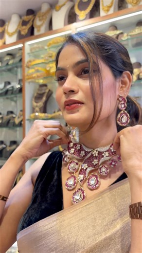 Nihaan silver & Fashion Jewellery on Instagram: "This necklace set is a true show-stopper, crafted with rich ruby tones, sparkling kundan work and delicate pearl highlights. The layered pendant drops add graceful movement, giving it a royal and festive charm. Paired with matching earrings, it beautifully frames the face and elevates any silk saree or bridal look. #nihaanfashionjewellery #inspirationjewellery #FashionJewellery #shopnownihaanfashionjewellery #bridaljewellery"