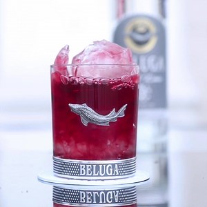 Celebrating Negroni week with Beluga Gold Line Negroni! 25 ml Beluga Gold Line vodka 15 ml Beluga Hunting Berry 25 ml Sweet Vermouth Pour Beluga Gold Line in a chilled rock glass over the ice cubes. In a mixing glass stir Beluga Hunting Herbal & sweet vermouth (for at least 40 seconds). Pour the mix in the ice ball and place it on top of the ice cubes in the rocks glass. Crack the ice ball with Beluga Gold Line hammer allowing the mixture to pour into the glass with vodka #belugaiceball #belugav