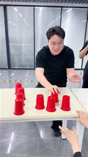 Cup stacking relay race, girls' team vs. boys' team