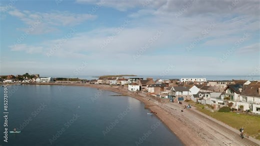 Captivating aerial footage of Skerries Beach, Ireland, filmed on June 16, 2024. This video showcases the charming coastal town with its serene beachfront, clear blue skies, and tranquil waters.