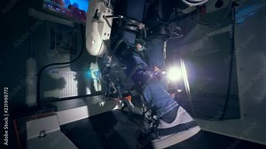 Physically challenged man is trying to walk with the walking simulation complex