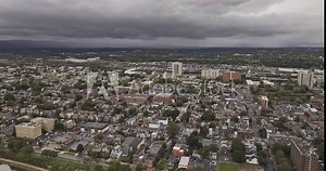 Harrisburg Pennsylvania Aerial v17 flyover Susquehanna river capturing cityscape of Olde Uptown, Midtown and Downtown under dark and ominous clouds sky - Shot with Mavic 3 Pro Cine - Sept 24th 2023
