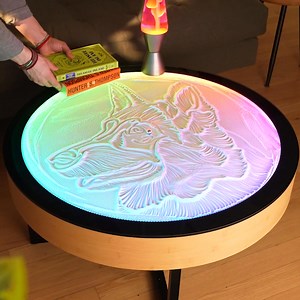 Imagine a coffee table that’s more than just furniture – it’s a mesmerizing work of art. Our Oasis kinetic art coffee table uses a small ball controlled by a hidden magnet to create intricate sand patterns that are soothing to watch. | Grounded Labs | Facebook