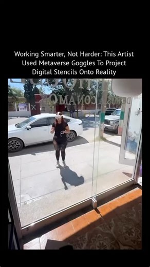 psycovibe on Instagram: "This isn’t freehand art. It’s precision-guided painting powered by mixed reality. 🧠🎨 The artist wears metaverse goggles with full-color passthrough, allowing digital stencils to be placed directly onto a real storefront window before any paint is applied. The system scans the physical space in real time, locking the virtual design to the glass with exact scale, alignment, and perspective. Every line is mapped first in software, then traced perfectly in the real world.