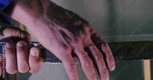 Making the glass. Making the glass for window on manufacture. Glass reinforcied by tape. Worker taped the glass. After grinding worker using reinforcing tape taping the corner of the glass. Paste Stock Video