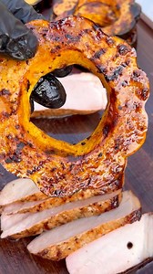 Acorn squash glazed with maple syrup, hot honey and a pat of butter. Paired with a beautiful juicy pork chop. #fall #fallvibes #pork #grilling #hookedonbbq | Hooked on BBQ