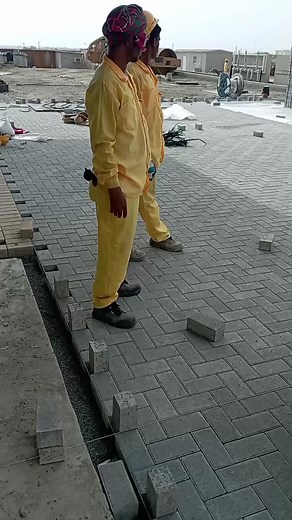 Construction Workers in Action at Busy Construction Site