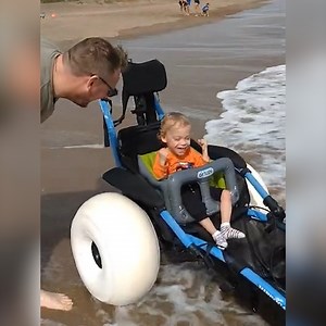 This child with cerebral palsy is experiencing beach waves for the first time, thanks to this innovative wheelchair. | In The Know