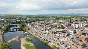 This aerial drone video shows the town of Dumfries in Dumfries and Galloway, south Scotland. The river Nith flows through the town center.