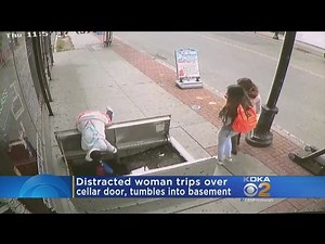 Pedestrian Distracted By Cell Phone Trips, Falls Into Basement