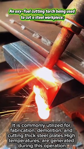 An oxy-fuel cutting torch being used to cut a steel workpiece.