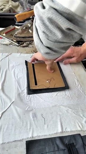 Brown paper guides fabric seam alignment