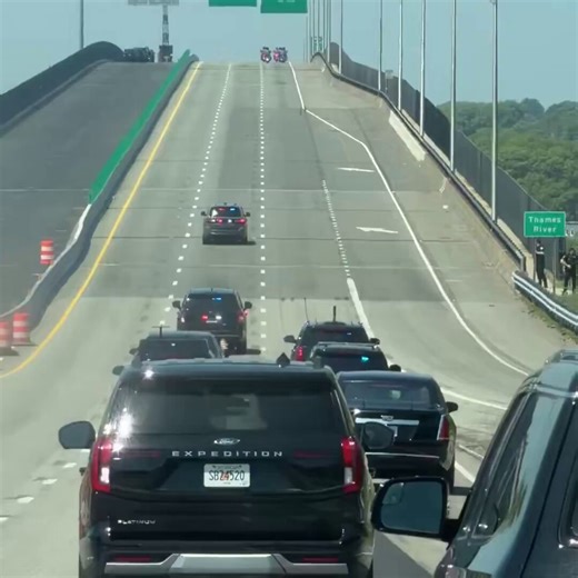 🚨 Trump's motorcade just rolled through New London, Connecticut..Air Force One landed at Groton-New London Airport before 11 a.m..motorcade was moving by 11:13..Class of 2026 in dress whites.. 21-gun salute.. the whole thing..and here's what nobody wants to say out loud..this is his first Connecticut appearance since reelection.. and he didn't come back for a fundraiser.. he didn't come back for a rally..he came back for cadets..Trump spoke at the Coast Guard Academy in 2017 too.. first term.. 