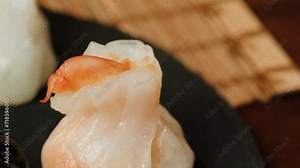 Various of colored dim sum on steamer pan close-up macro. Steaming Technique. Chinese dessert food. Dimsum with shrimps, fish and meat.