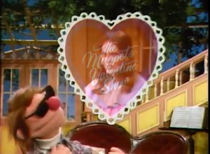 The Muppets Valentine Show aired on ABC on January 30, 1974. It was one of two pilots produced during the planning stages for The Muppet Show. The other pilot was The Muppet Show: Sex and Violence, which aired in 1975. Plot: The Muppets and special guest star Mia Farrow, host Wally has writer's block—he can't think of material for the show that represents the true meaning of love. He asks the other Muppets and Mia for assistance, with mixed results. Trivia: The cast of Muppeteers closely matches