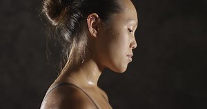 Fitness woman sweating taking a breath after working out