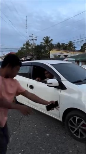 Pedestrian Walks Over Car A dramatic incident occurred when a man walked across the hood of a car parked along a pedestrian lane. The incident happened as the pedestrian was crossing the road, and he seemingly used the car's hood as a pathway. The moment was captured on camera, showing the pedestrian calmly walking across the car's hood. The driver, who was reportedly not present at the time, might face consequences for parking on the pedestrian lane. The incident highlights the issue of pedestr