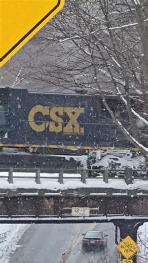 A pair of fresh CSX SD70AC's lead a train over Penfield road, Rochester! [Subscribe!] #train