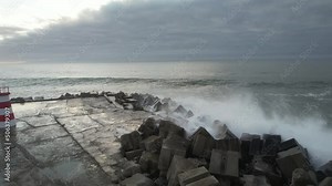 Wave crash into rocks, turbulent ocean