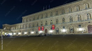 Night view of the palazzo pitti gallery timelapse hyperlapse in the italian city florence. Illuminated facade and entrance