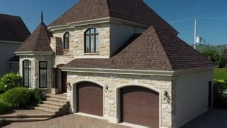 Bring out the best in your home with IKO Dynasty Shadow Brown #shingles! 🌟 Their rich earthy tones and transitional shades are a perfect match for stone, wood, masonry, brick, or siding in brown, grey, or cream. Tough and versatile, these shingles work with any style while giving your roof a natural, grounded look. 💪 | IKO Roofing