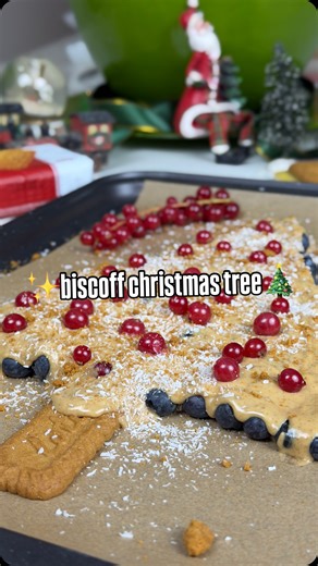 a little holiday magic ✨💫 with @lotusbiscoffcy Biscoff Christmas Tree 🎄 You’ll need: fresh blueberries white chocolate chips, melted Biscoff biscuits Biscoff Spread smooth or crunchy fresh cranberries shredded coconut 1. Line a baking sheet with parchment paper. Arrange the blueberries into the shape of a tree. 2. Take 1 Biscoff biscuit & place it at the bottom of the tree. 3. Melt the white chocolate chips until smooth. Stir in melted biscoff spread until fully combined. 4. Drizzle the biscof