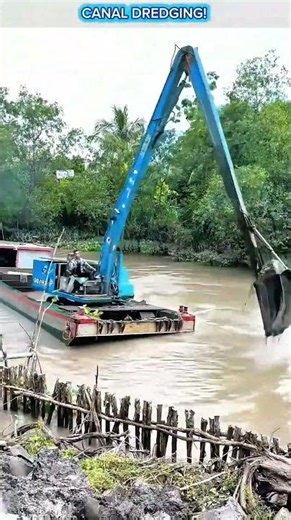 Long Reach Excavator Dredging Canal.