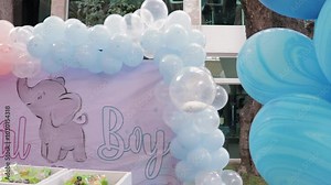 Setting up the dessert table for a gender reveal celebration