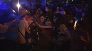 Police van drives through protesters